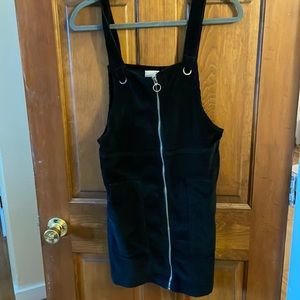 Black corduroy material minidress with 2 front pockets